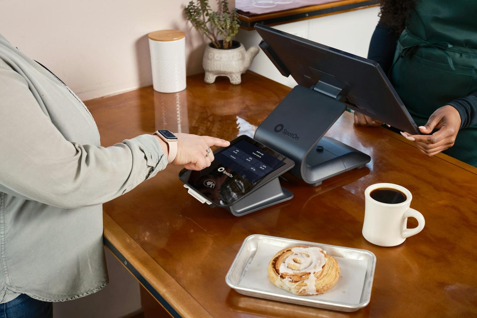 Customer tapping a card on a point-of-sale terminal